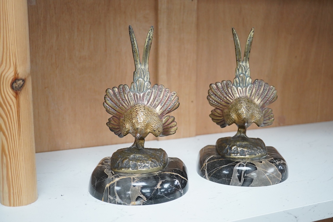 A pair of bronze peacock bookends, with remains of coloured pigments, marble plinths, signed R. Leclerc, 20cm